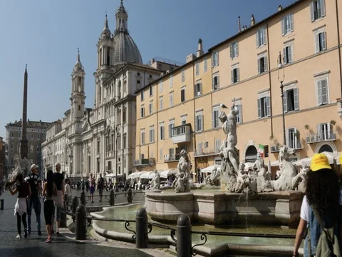 Church that overlooks the square with fountains and obelisk Stock Footage