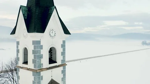 Church Standing in Middle Of Fields On Winter Morning. Reveals Bell, Clock, Roof Stock Footage 250416337