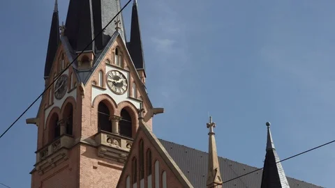 Church steeple in the city with clock Stock Footage 100113619