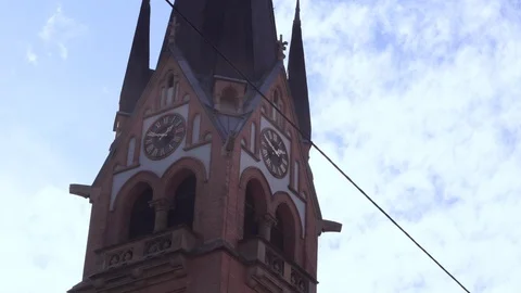 Church steeple in the city with clock Stock Footage 100120711
