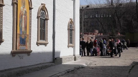 Church in the summer. overall plan. people near the church celebrate Easter. Video stock 123713883