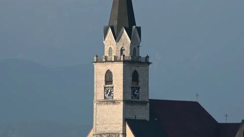 Church tower with clock in old town Kranj, Slovenia Stock Footage 133901035