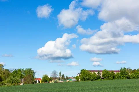 Church tower with clouds Stock Photos