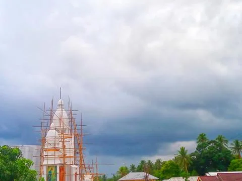 Church tower with cloudy clouds in the background Stock Photos