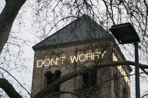 Church tower shows message "don´t worry" Stock Photos