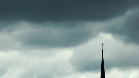 Church tower silhouette and dramatic clouds Stock Footage 133657243