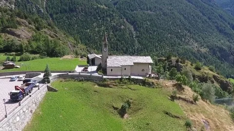 Church in the valley of the mountain Stock Footage 79564371