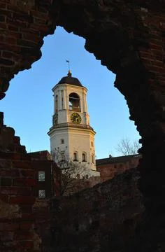 Church in Vyborg through a crack in the wall Stock Photos