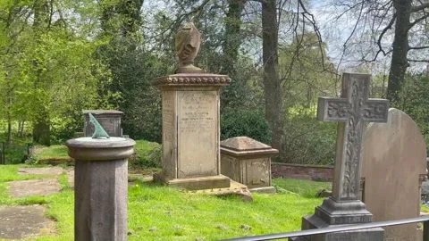 Churchyard cemetry gravestones sun dial countryside Stock Footage 240865463