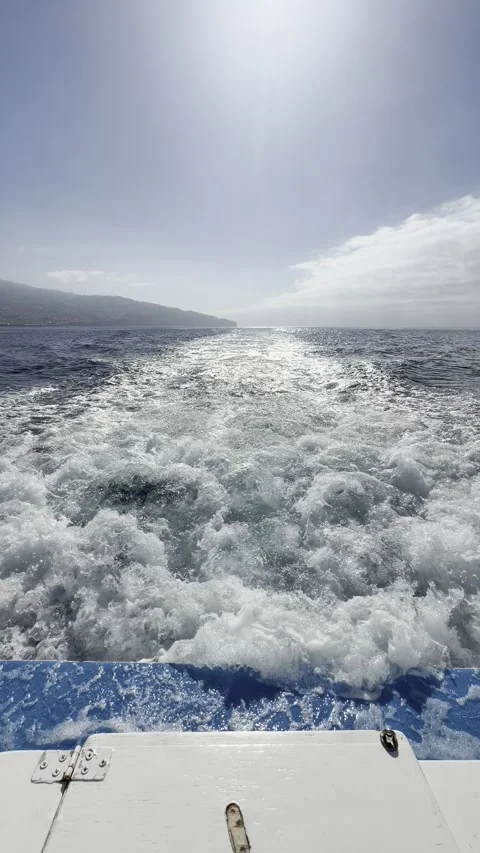 Churning Boat Wake and Bright Sun Glare on Ocean Stock Footage 340104848