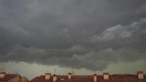 Churning Dark Storm Clouds Raced Ominously Overhead, Their Shadows Racing Across Stock Footage 327013761