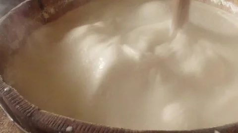 Churning fermented sheep's milk timber gadget super close-up Stock Footage 43224023