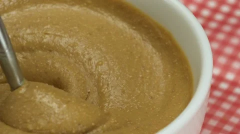 Churning peanut butter, Slow Motion Stock Footage