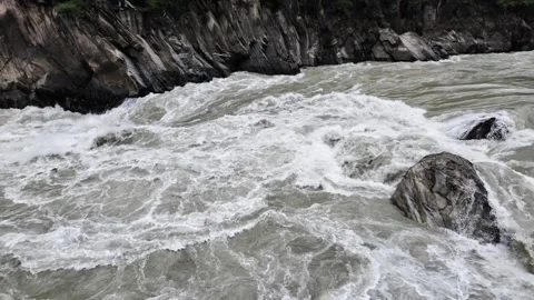 Churning River in Narrow Gorge with Boulder and White Water Stock Footage 340130583
