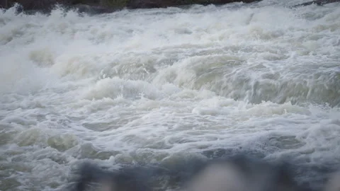Churning White Water Rapids Flowing over River Rocks Vidéo 338446894
