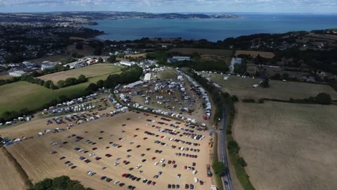Churston, Devon, England: Drone View: Torbay sea and Churston Steam Fair Stock Footage 222757961