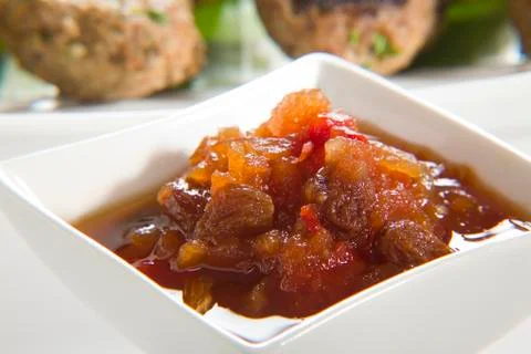 Chutney with meatballs in background Stock Photos