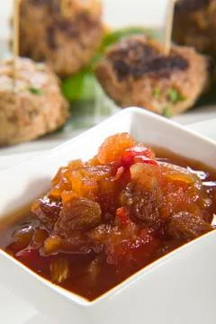 Chutney with meatballs in background Stock Photos