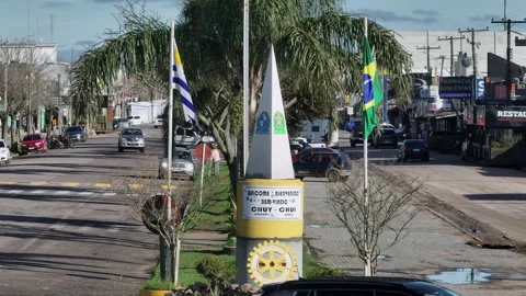 Chuy Border Avenue Monument and Flags Between Uruguay and Brazil Stock Footage 345398905