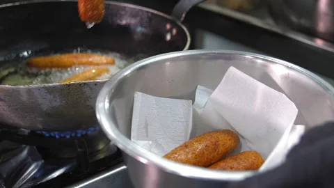 Chvishtari, Georgian cornbread with cheese inside, is fried in pan in oil. Stock Footage 267668607