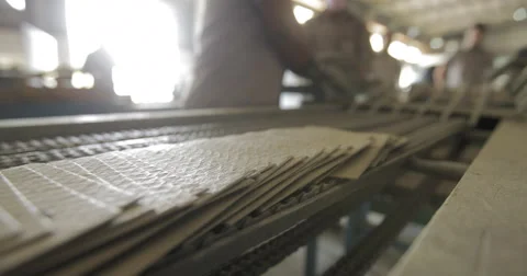 CI Workers Picking Up Battery Separators from Industrial Conveyor Belt (4K) Stock Footage 60787649