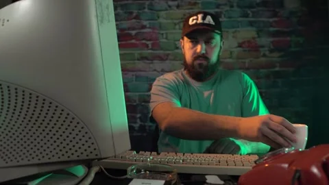 CIA Data Analyst From 1990's Working on Desktop Computer and Drinking Coffee Stock Footage 302443663