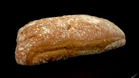 Ciabat bread on a black background close-up. Видео 148499871