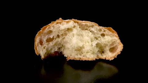 Ciabat bread on a black background close-up. Stockbeeldmateriaal 150808559
