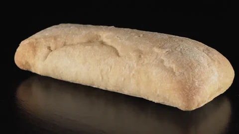 Ciabat bread on black background 스톡 동영상 137796028
