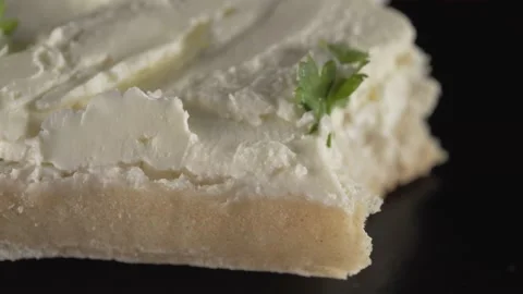 Ciabatta bread with curd cheese and herbs on black background Vídeos de archivo 137795781