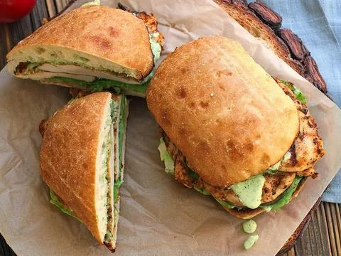 Ciabatta bread filled with chunks of chicken meat Stock Photos