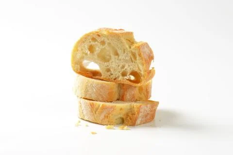 Ciabatta bread slices on white background Stock Photos
