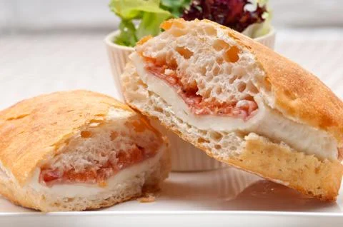 Ciabatta panini sandwich with parma ham and tomato Stock Photos