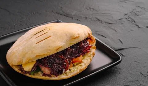 Ciabatta sandwich with pulled pork and red cabbage Stock Photos