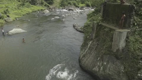 Cianjur, West Java, Indonesia - Boys jumping into the river - Scenery Nature Stock Footage 155162655