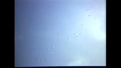 CIDG paratroopers learn to glide down from the C-130 aircraft - 1969 Stock Footage 91264439