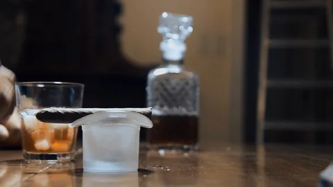 Cigar and booze on the table Stock Footage 87333392