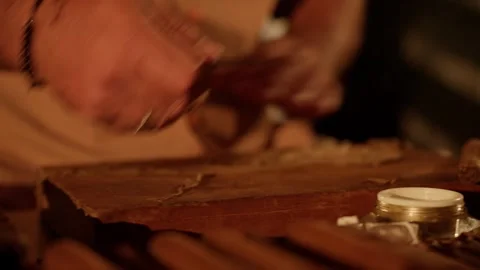 Cigar Maker Crafts a Hand Rolled Cuban Cigar in a Lounge Cutting Tobacco Leaves Stock Footage 288038839