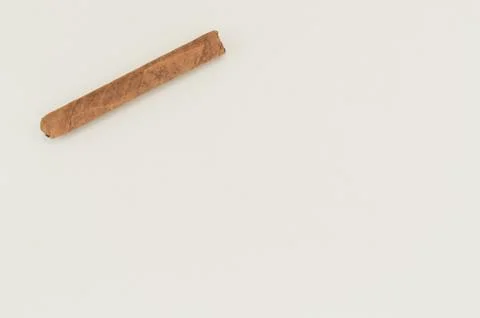 Cigar top perspective on a blank surface Stock Photos