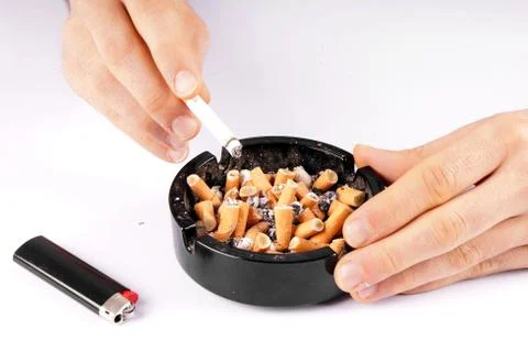 Cigarette and ashtray Stock Photos