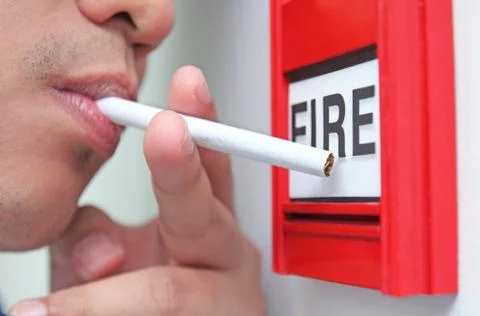Cigarette and fire Stock Photos