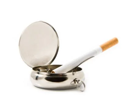 Cigarette in an ash-tray Stock Photos