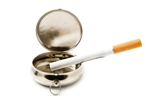 Cigarette in an ash-tray Stock Photos