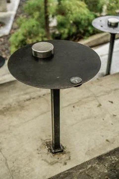 Cigarette ashtray on the cafe table Stock Photos
