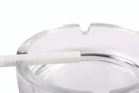 Cigarette on ashtray Stock Photos