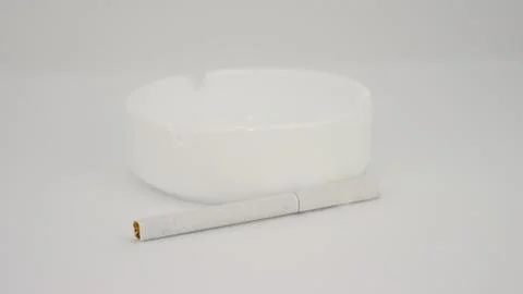 Cigarette with an ashtray white background Foto stock