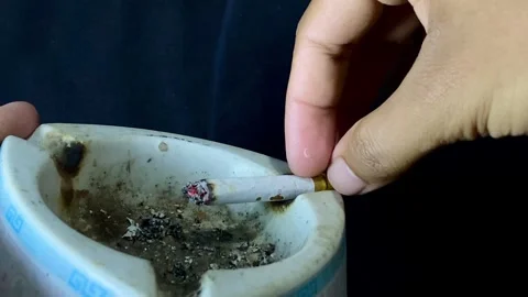Cigarette Being Extinguished in Ashtray Close Up Stock Footage 327176882