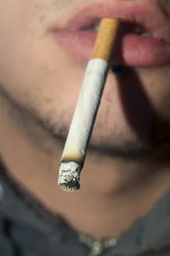 Cigarette between his lips Stock Photos