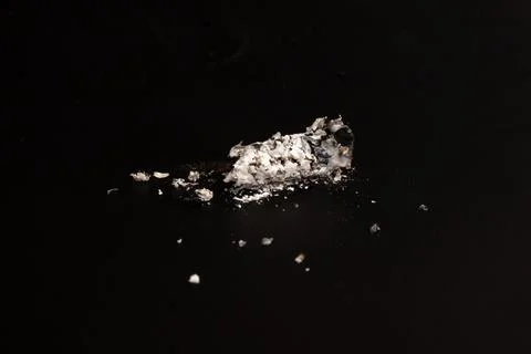Cigarette on black background ash Stock Photos