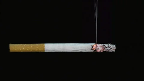 Cigarette on black background Video stock 210544024